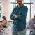 portrait-of-young-smiling-businessman-standing-in-2026-03-20-04-11-21-utc-scaled.jpg